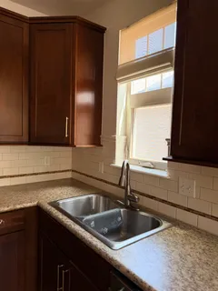a kitchen with a sink and a window