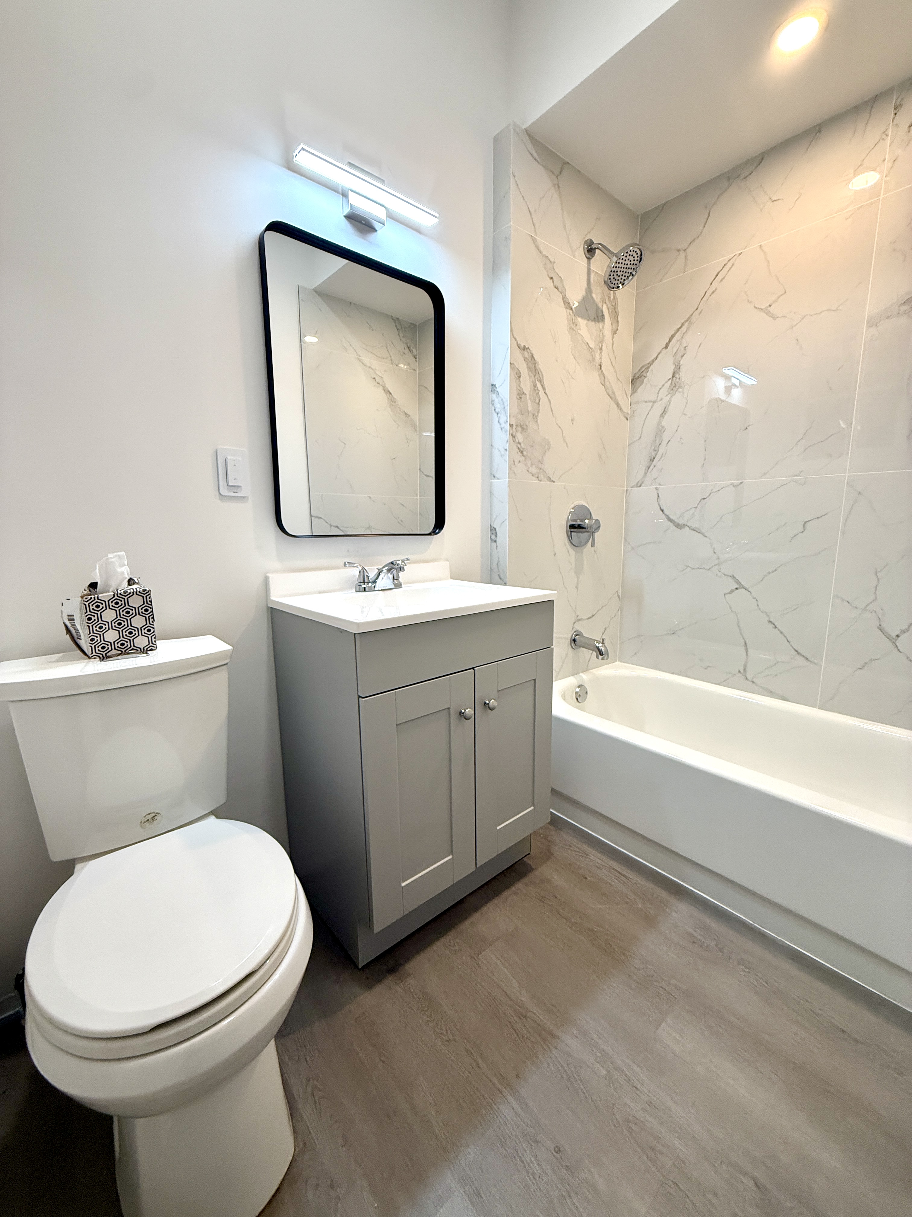 31 Seeley Street, Unit Undisclosed Brooklyn, NY 11218 - Photo 13 of 31 a bathroom with a toilet a sink and a bathtub