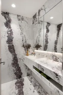 a bathroom with a bathtub and shower