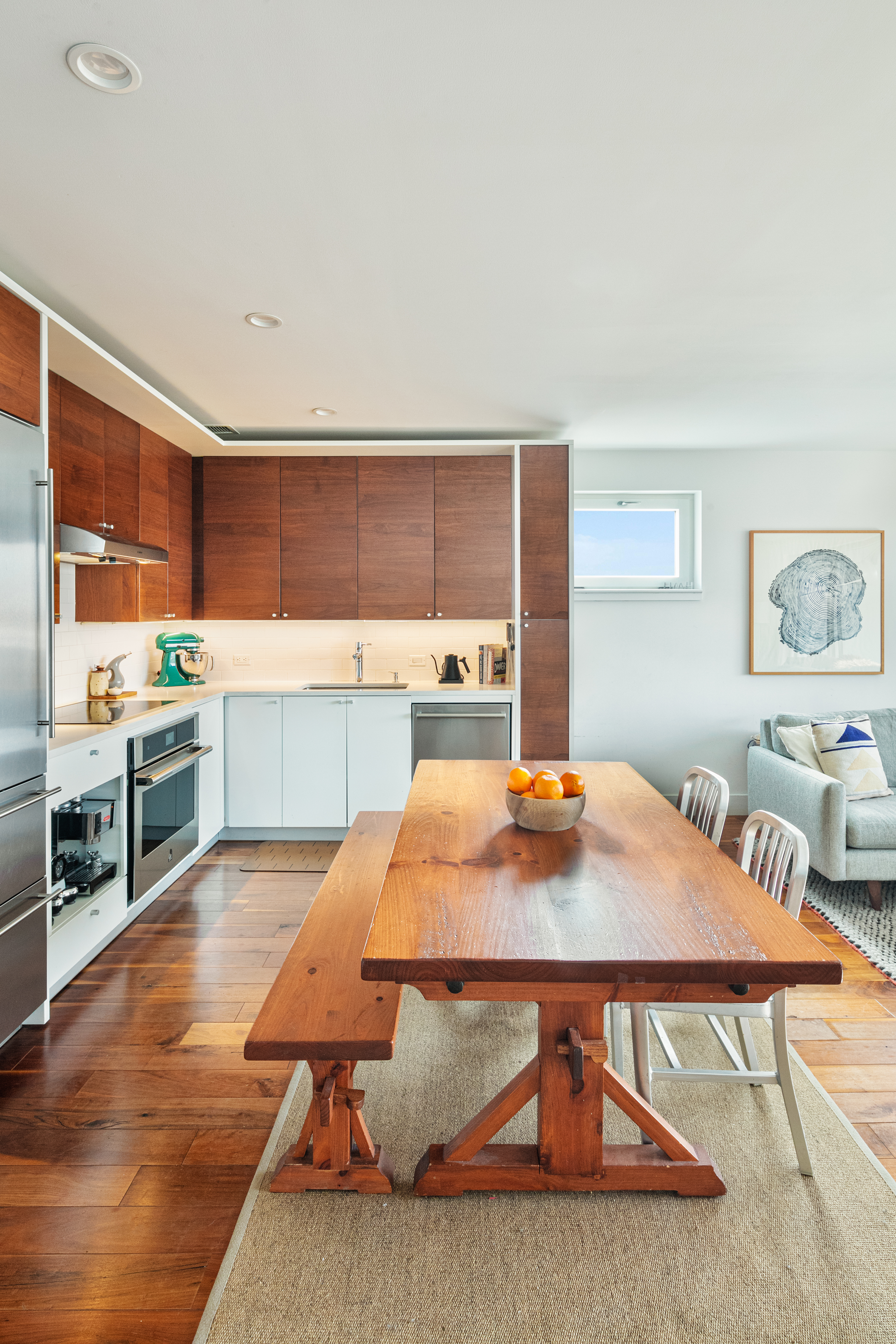 255 Columbia Street, Unit S4 Brooklyn, NY 11231 - Photo 2 of 7 a kitchen with stainless steel appliances kitchen island granite countertop a table chairs sink and cabinets