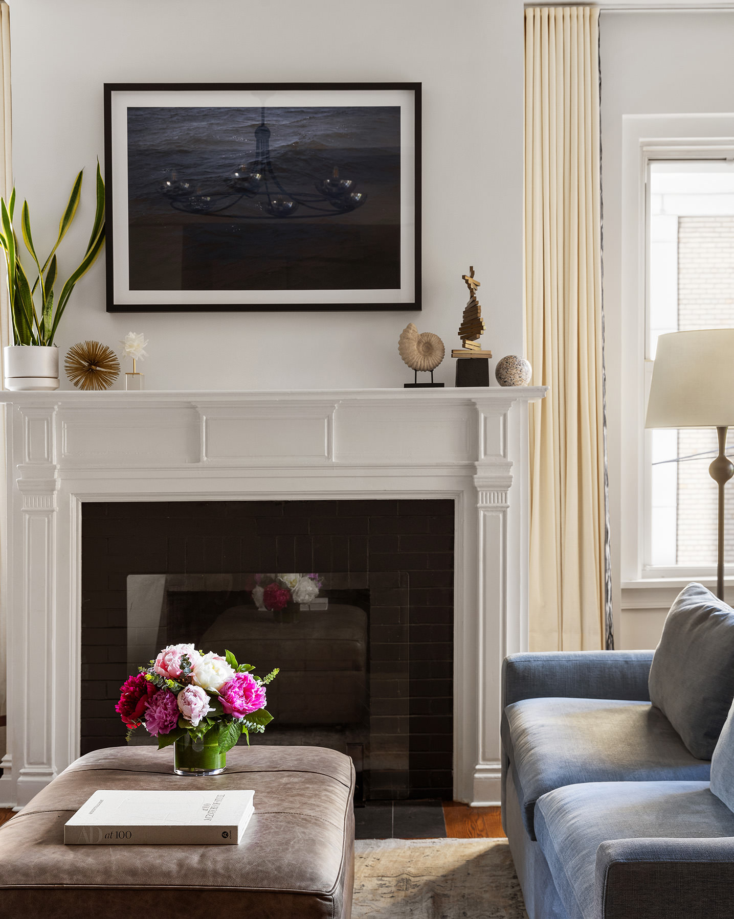 25 5th Avenue, Unit 8F Manhattan, NY 10003 - Photo 3 of 9 a living room with a fireplace furniture and a fireplace