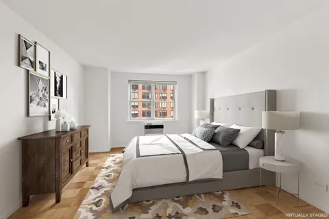 a bedroom with a large bed and a couch