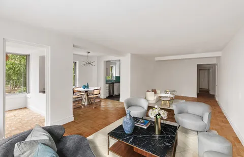 a living room with furniture and a table
