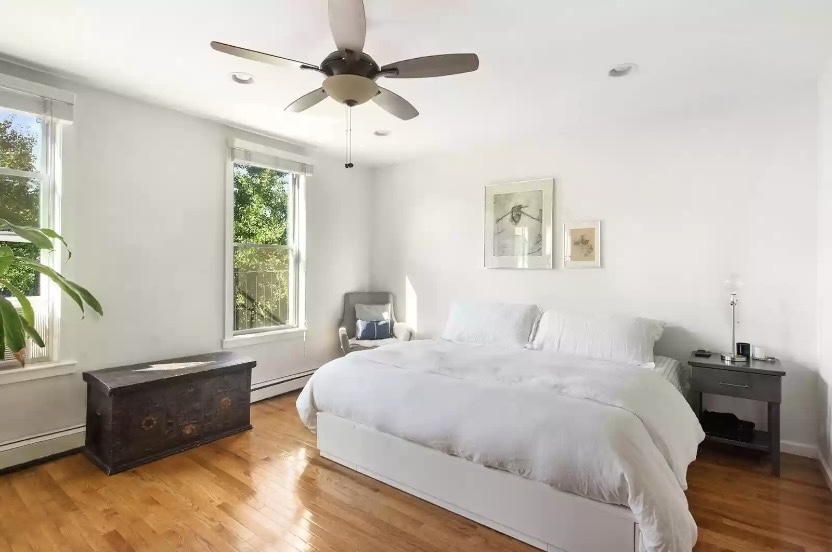 185 A Powers Street, Unit 3 Brooklyn, NY 11211 - Photo 3 of 12 a bedroom with a large bed and a window