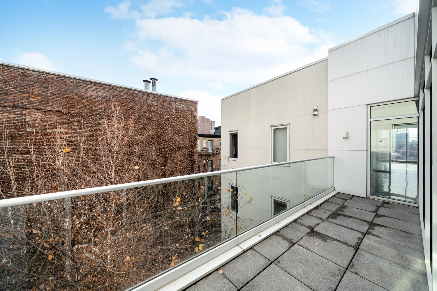a kitchen with stainless steel appliances white cabinets and a refrigerator