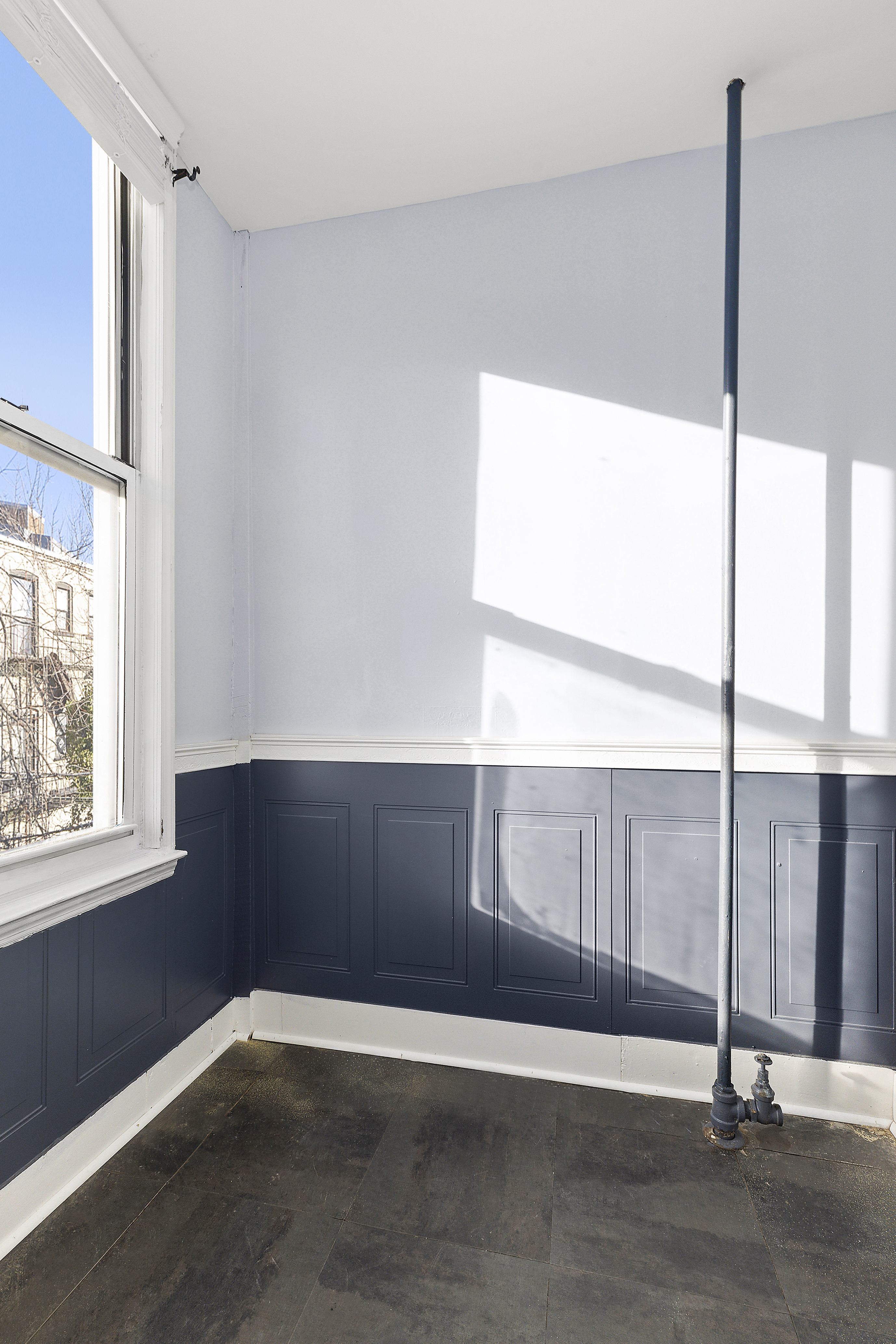 693 MacDonough Street, Unit 2 Brooklyn, NY 11233 - Photo 2 of 11 a view of an empty room with wooden floor and a window