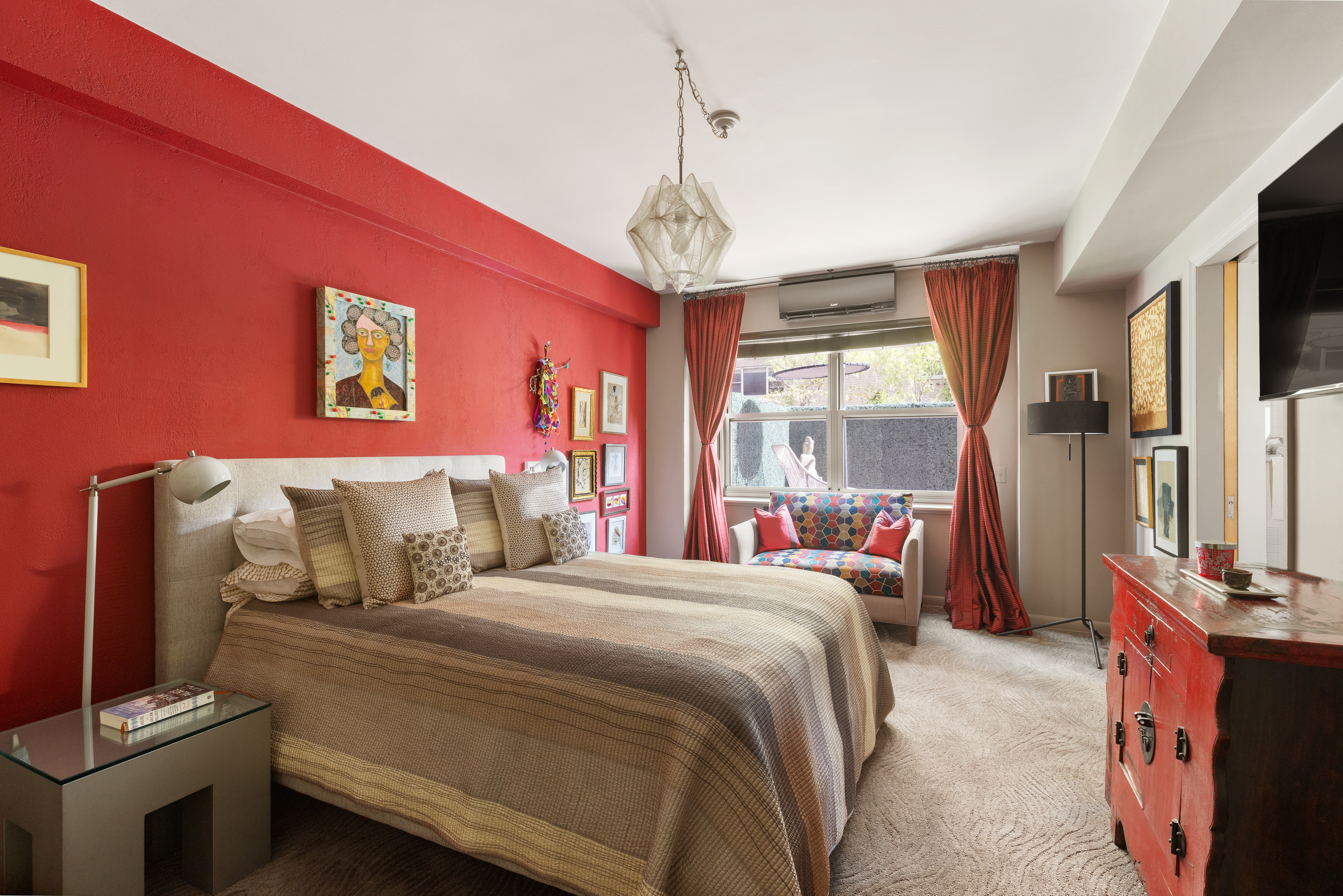 11 5th Avenue, Unit 2D Manhattan, NY 10003 - Photo 6 of 11 a bedroom with a bed and a chandelier