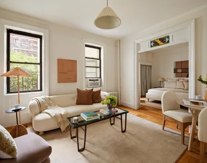 a living room with furniture and a window