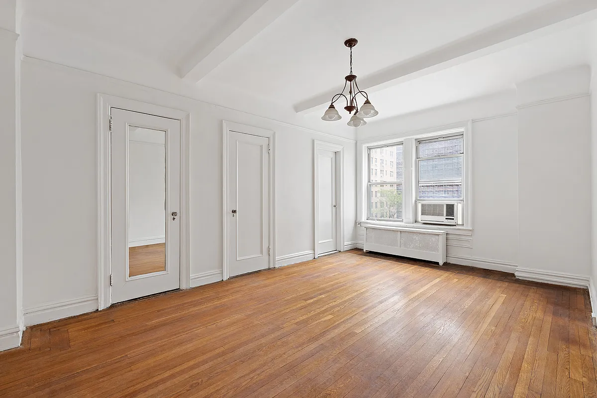 250 West 94th Street, Unit 5D Manhattan, NY 10025 - Photo 11 of 17 a view of livingroom with hardwood floor and window
