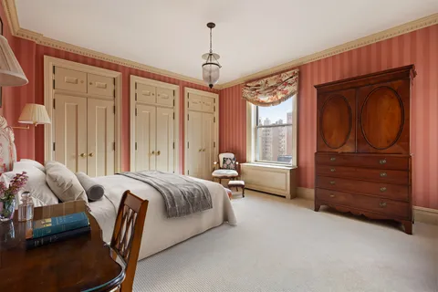 a bed room with a bed and a window