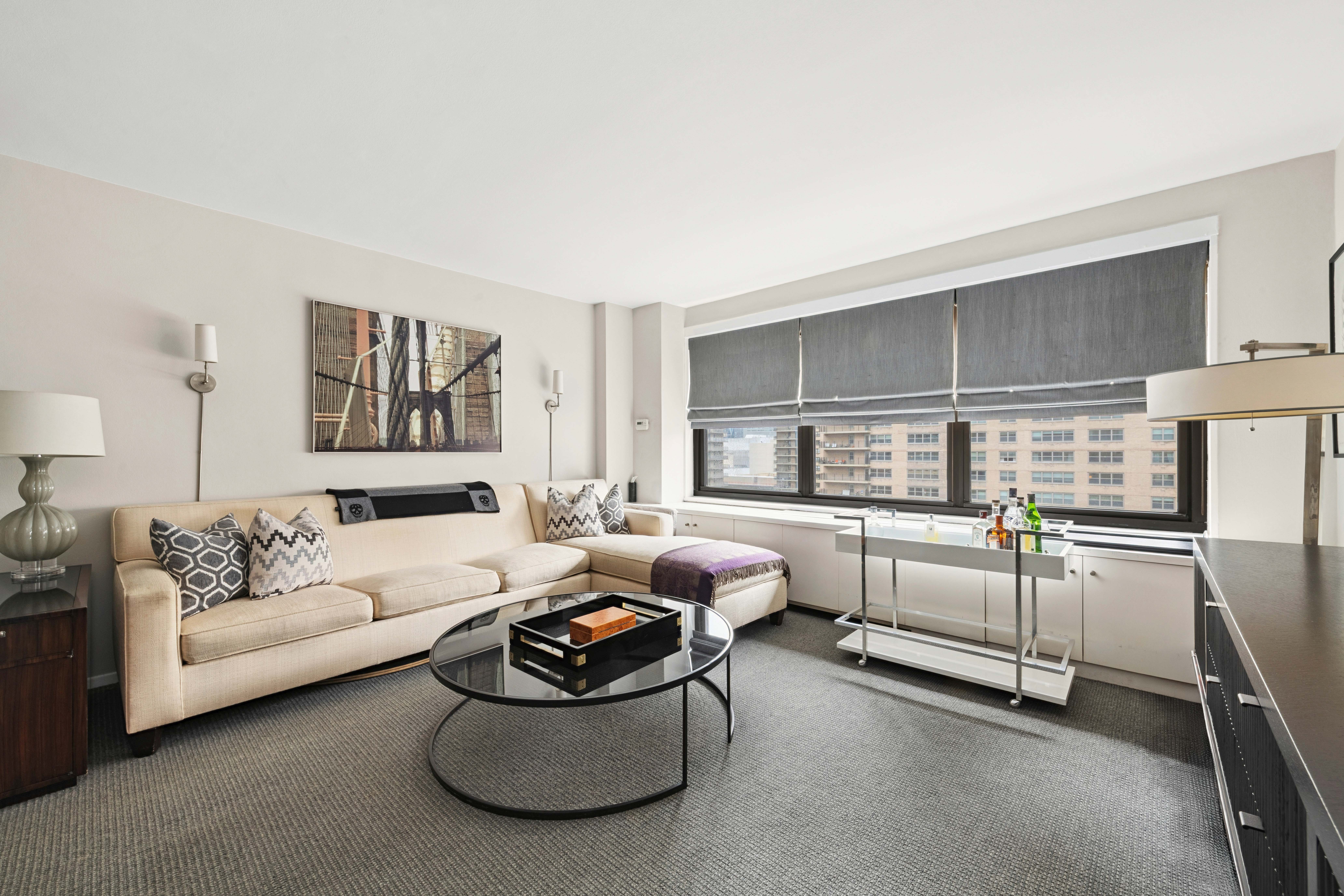 a living room with furniture and windows
