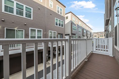 a view of a brick building from a balcony