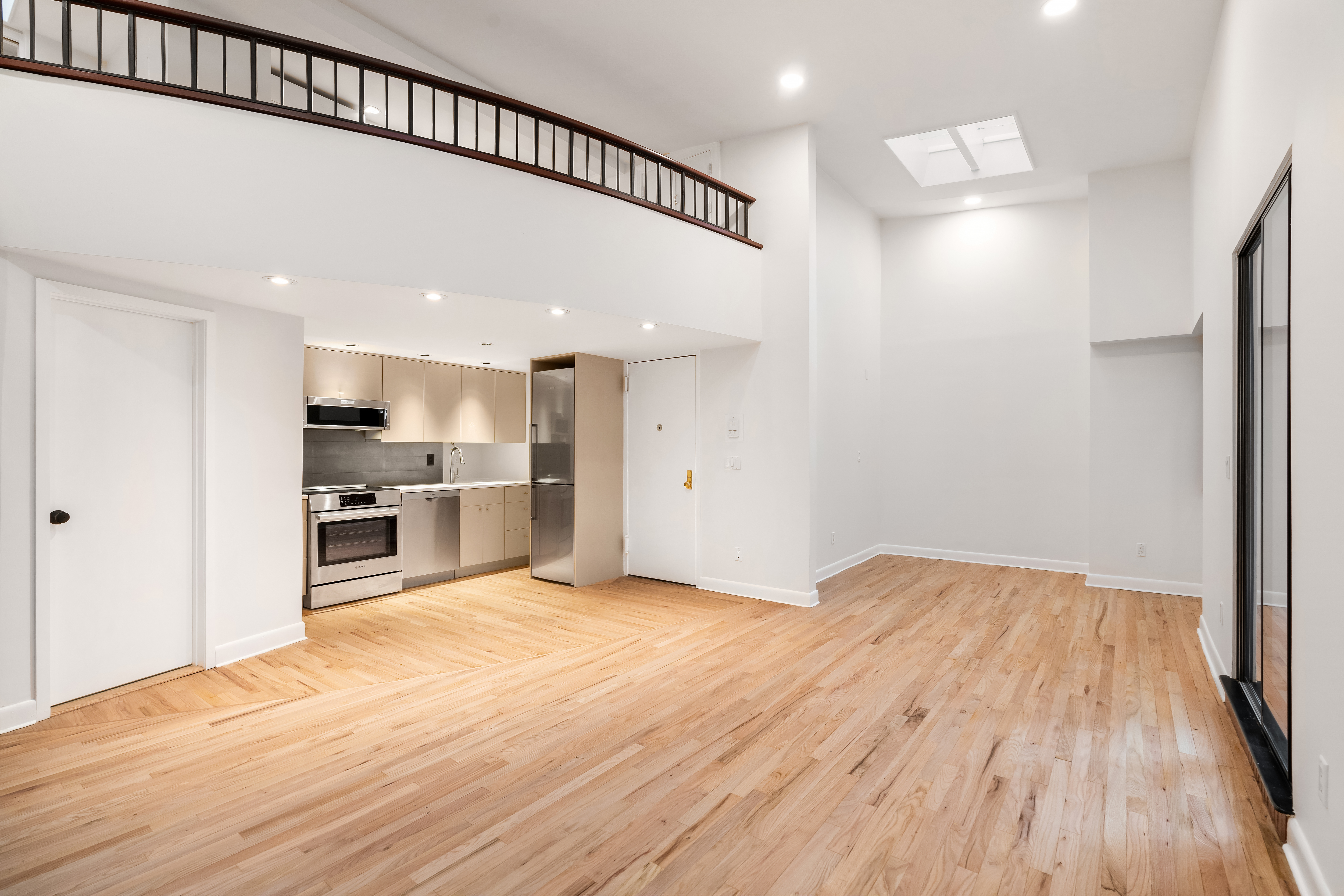 51 East 10th Street, Unit 9 Manhattan, NY 10003 - Photo 4 of 9 a view of kitchen with wooden floor