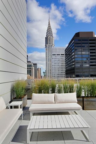 325 Lexington Avenue, Unit 10D Manhattan, NY 10016 - Photo 13 of 16 a view of a patio with couches and potted plants