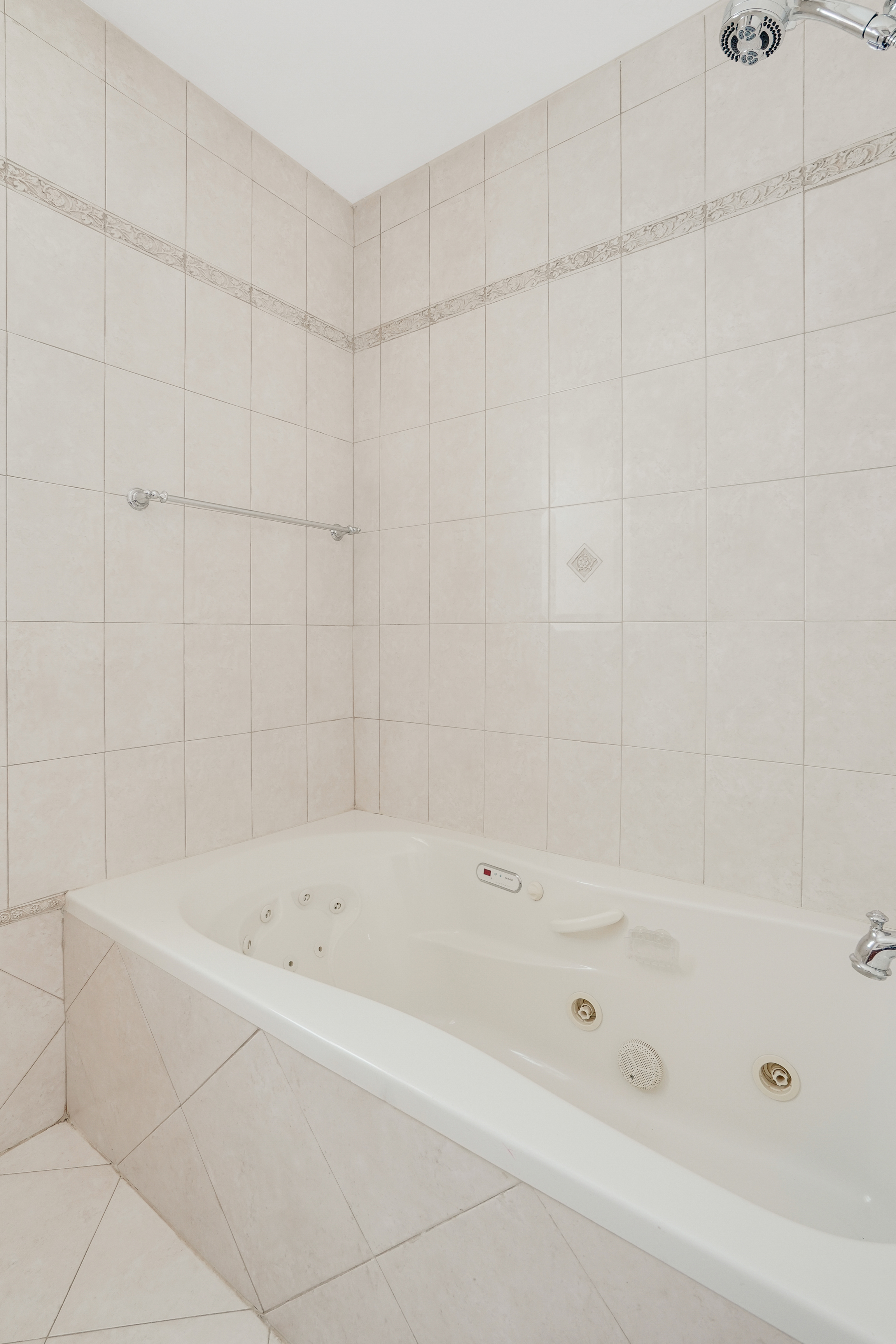 8028 Harbor View Terrace Brooklyn, NY 11209 - Photo 8 of 16 a bathroom with a bathtub and a shower
