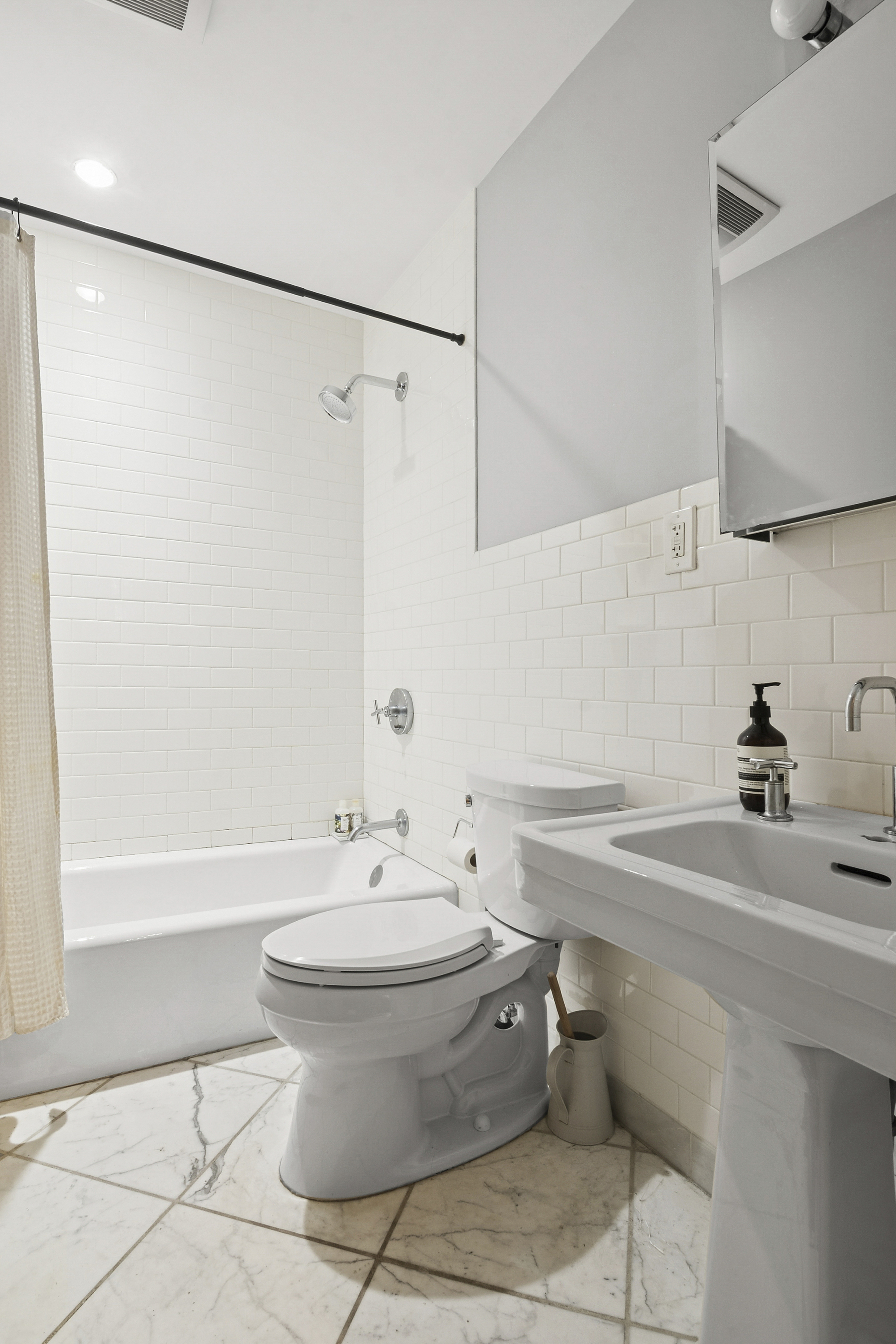 581 Greene Avenue, Unit 1 Brooklyn, NY 11216 - Photo 4 of 7 a bathroom with a sink toilet and shower