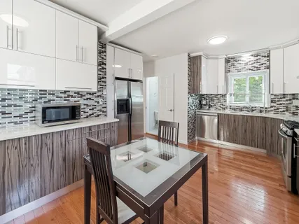 a living room with furniture wooden floor and a fireplace