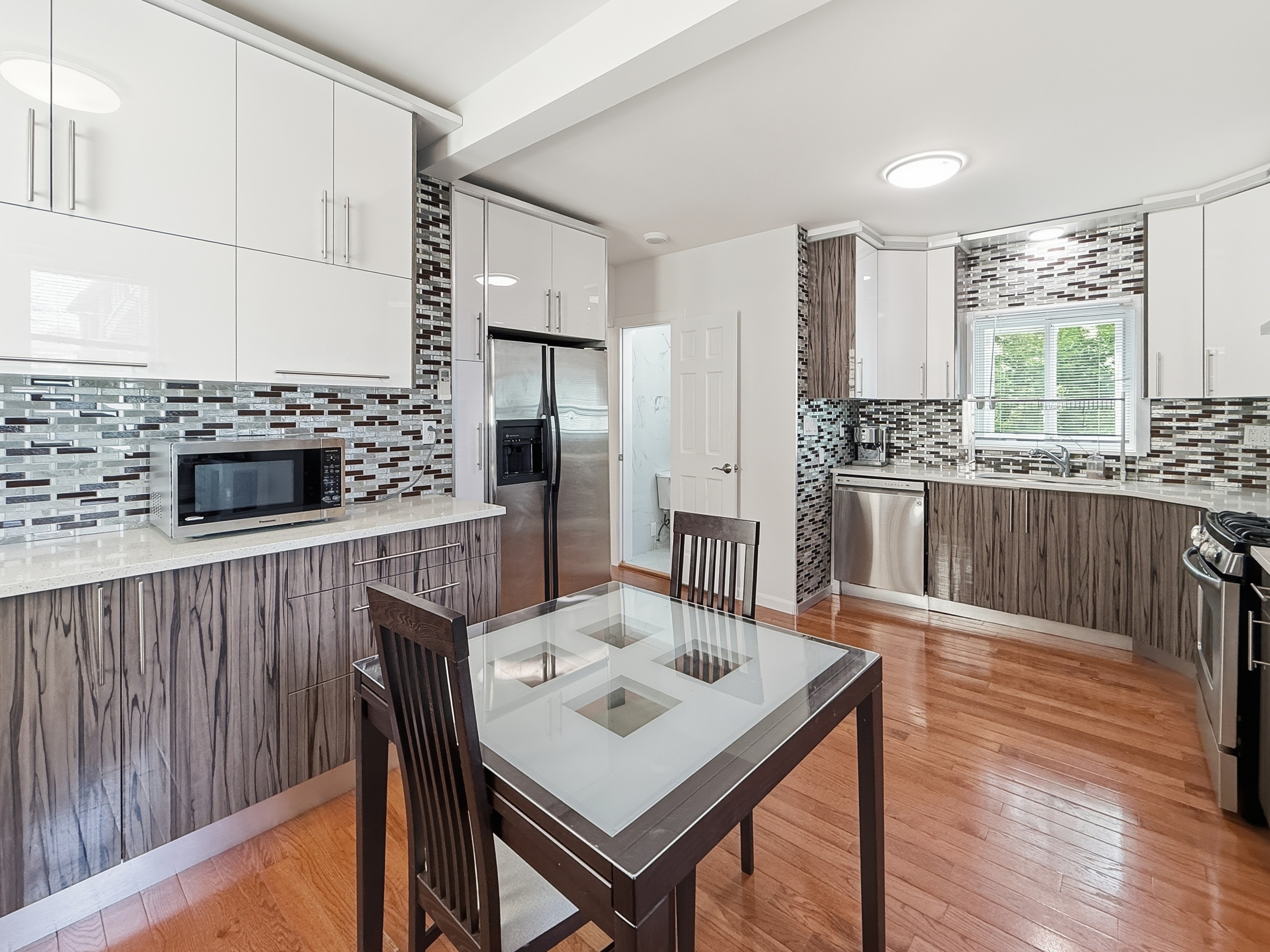 3735 Oceanic Avenue Brooklyn, NY 11224 - Photo 8 of 26 a living room with furniture wooden floor and a fireplace