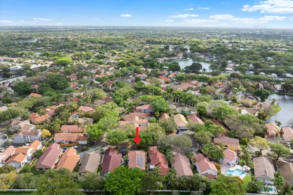 a view of a backyard with sitting area