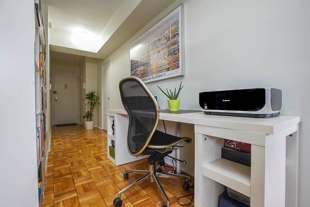 105 Ashland Place, Unit 5E Brooklyn, NY 11201 - Photo 8 of 17 a living room with furniture and a flat screen tv