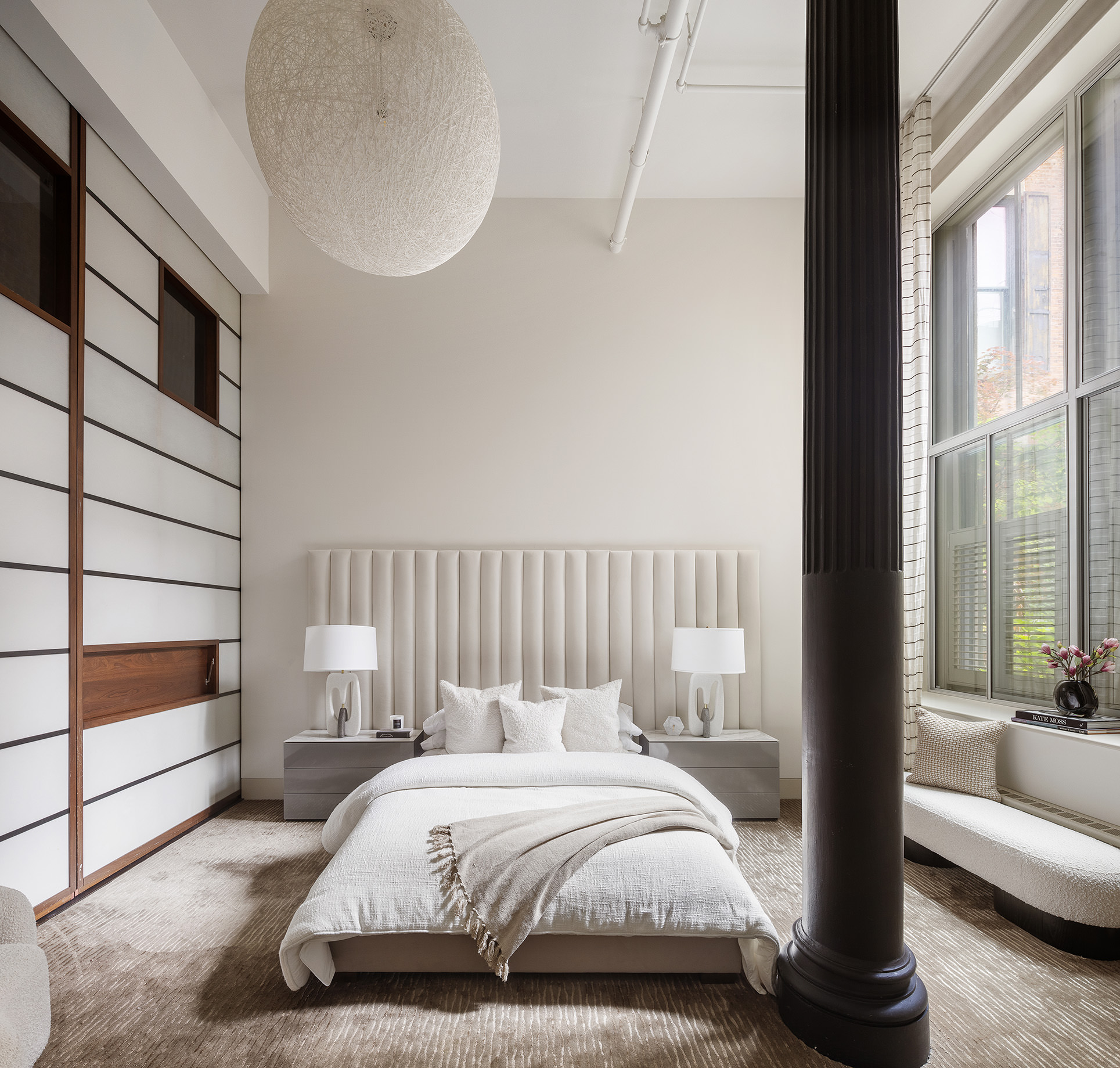 56 Crosby Street, Unit 2A Manhattan, NY 10012 - Photo 17 of 21 a bedroom with a bed and a large window with outer view