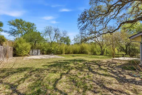 an aerial view of a house with outdoor space