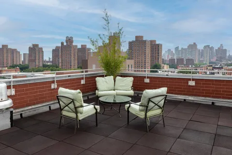 a view of a terrace with sitting area