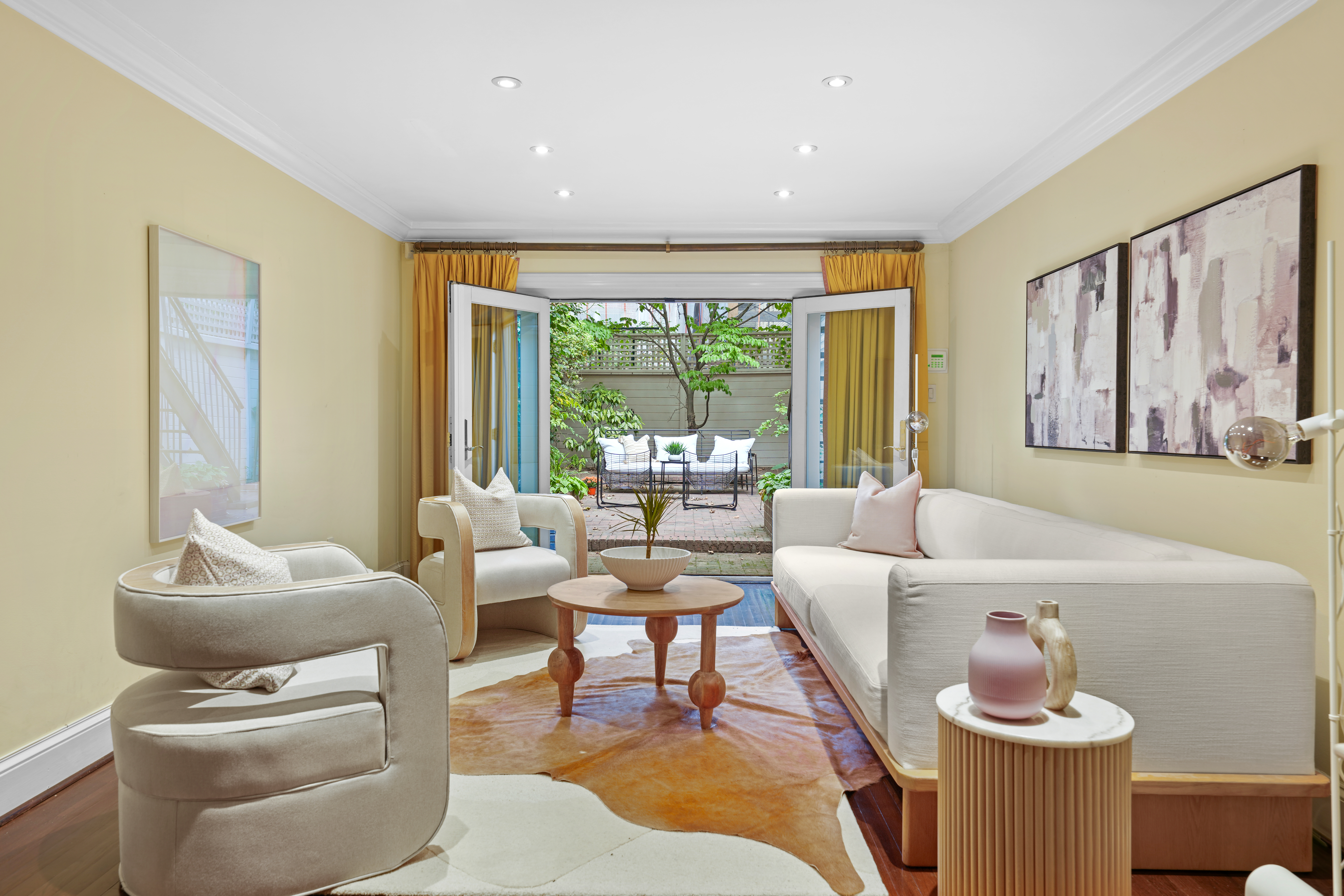247 East 71st Street Manhattan, NY 10021 - Photo 2 of 31 a living room with furniture and a large window
