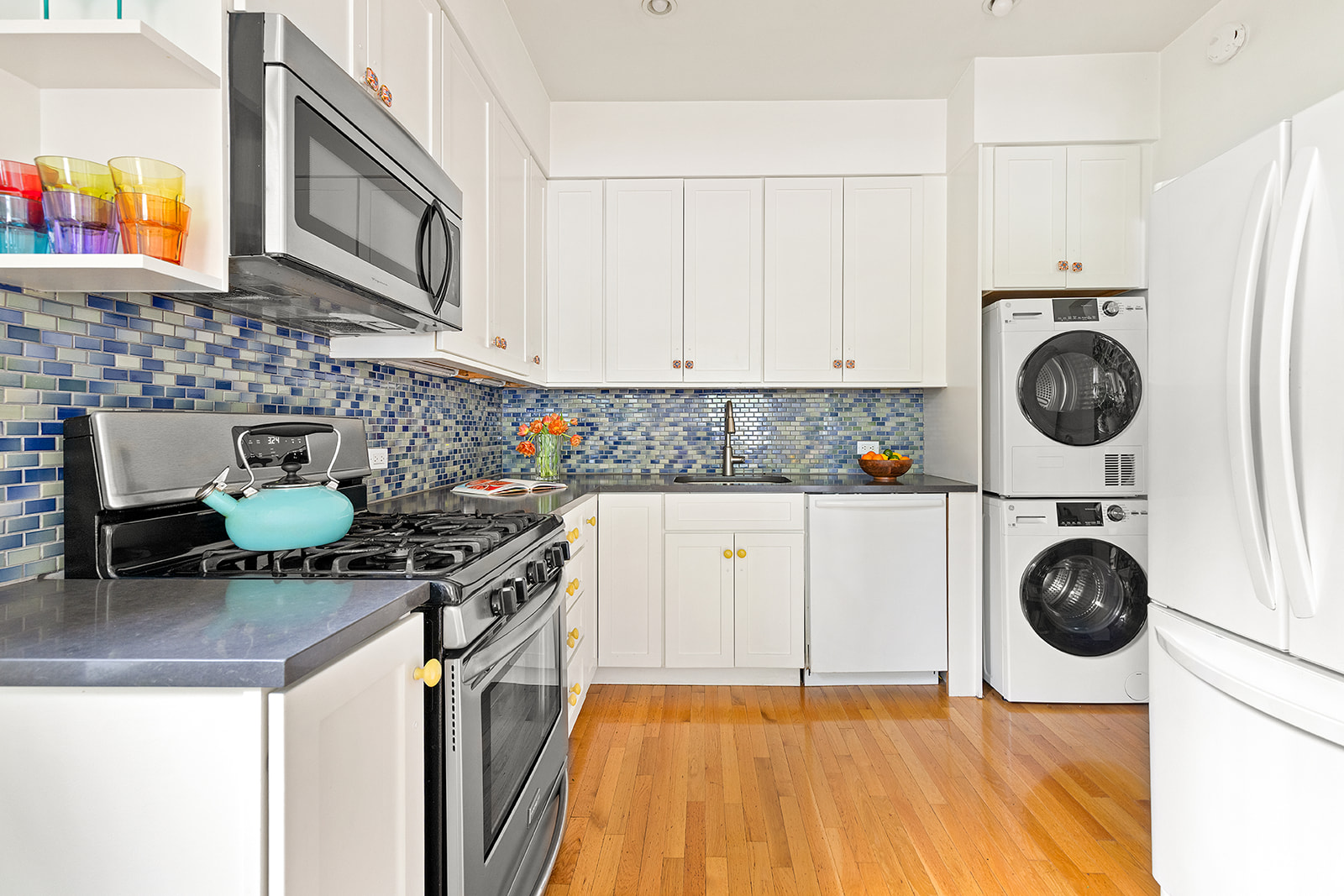295 St Johns Place, Unit 1A Brooklyn, NY 11238 - Photo 3 of 13 a kitchen with a stove a sink and a cabinets