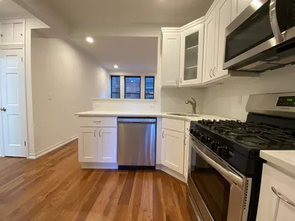 a kitchen with a stove and a microwave