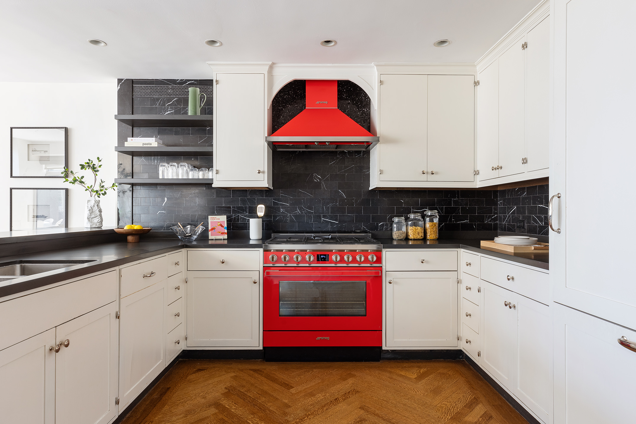 201 West 17th Street, Unit PHF Manhattan, NY 10011 - Photo 6 of 22 a kitchen with stainless steel appliances granite countertop a stove and white cabinets