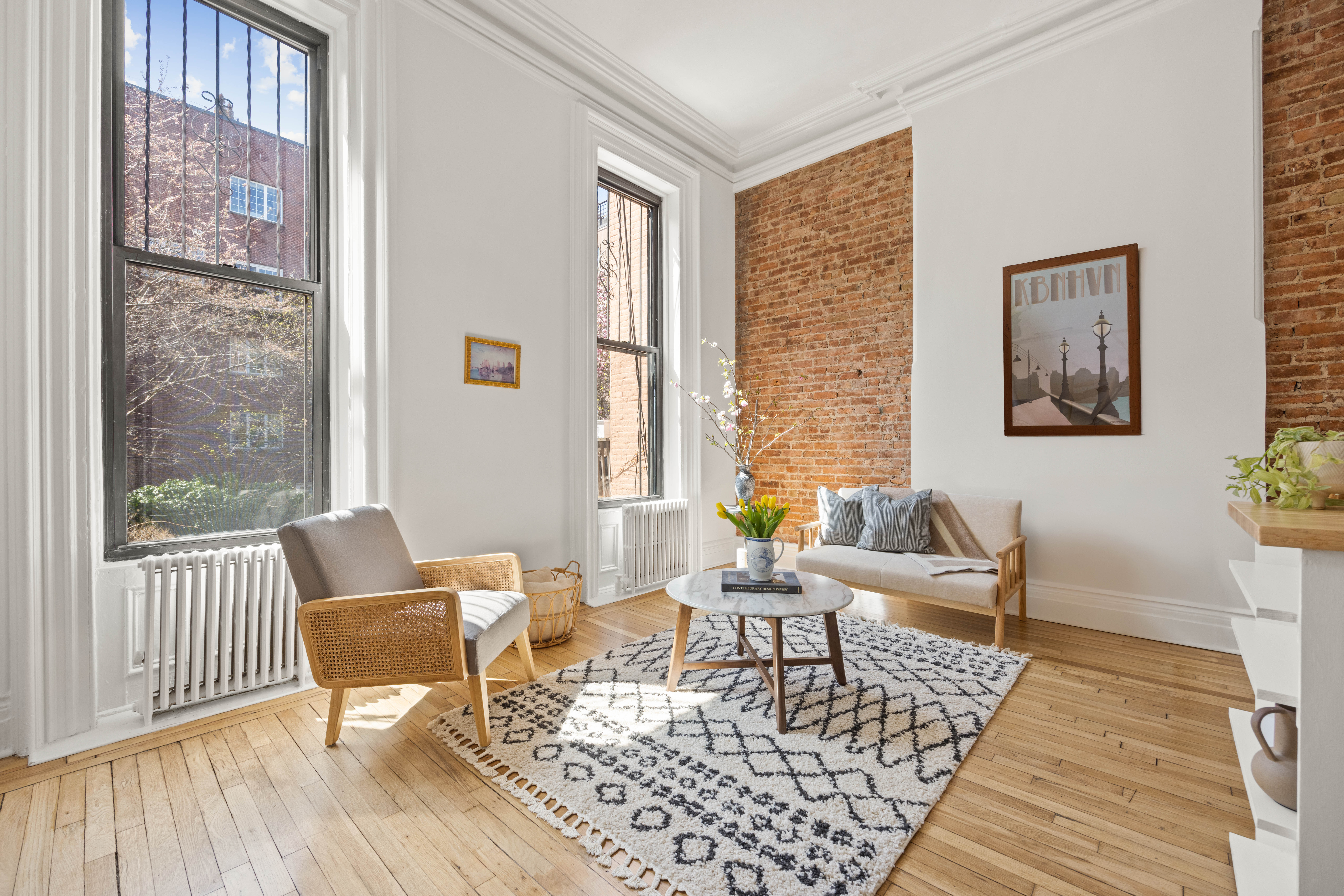144 Park Place, Unit 3 Brooklyn, NY 11217 - Photo 1 of 6 a living room with furniture and a window