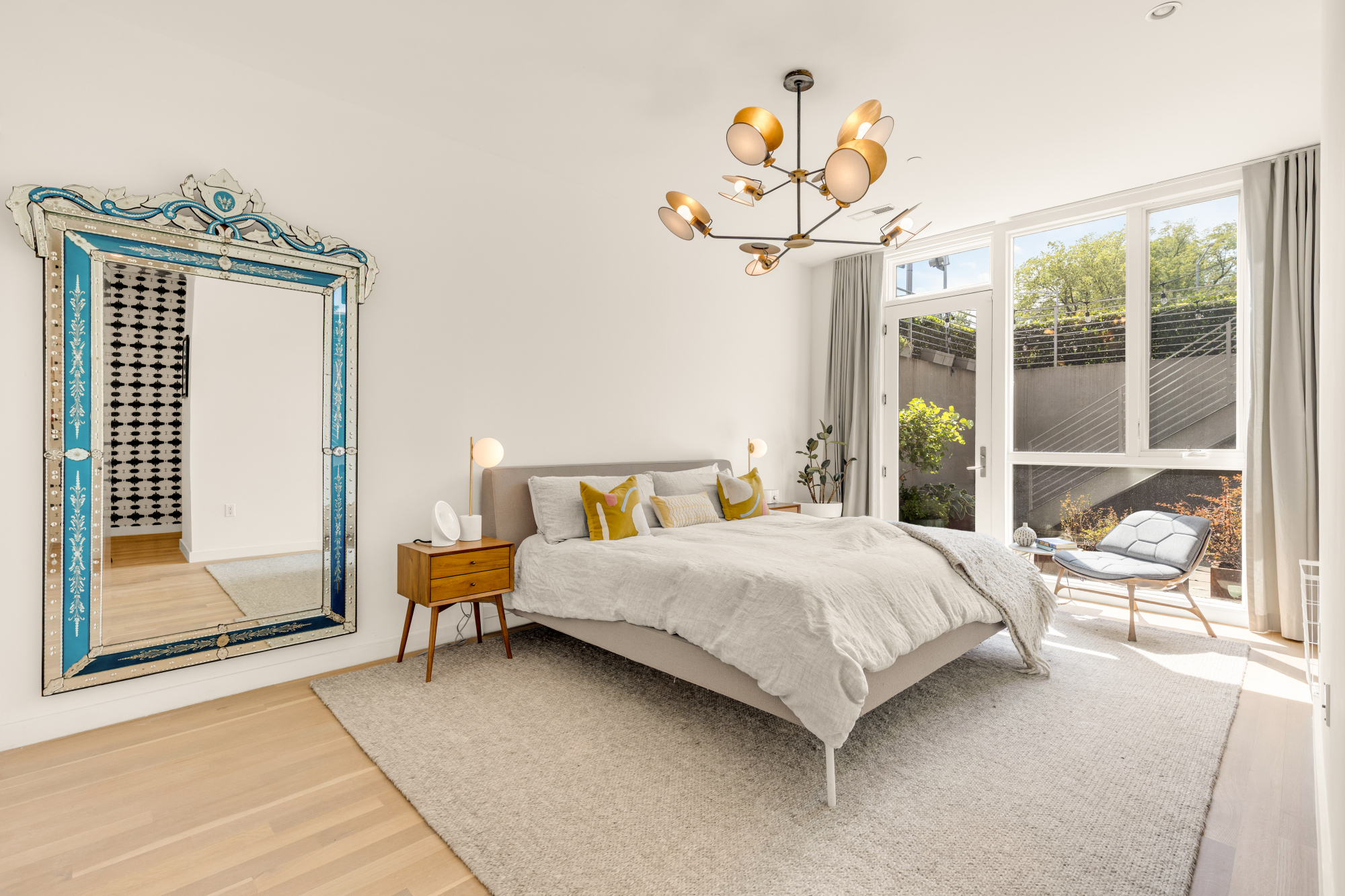 1501 4th Street Northwest, Unit 1 Washington, DC 20001 - Photo 28 of 41 a bedroom with a bed and a chandelier