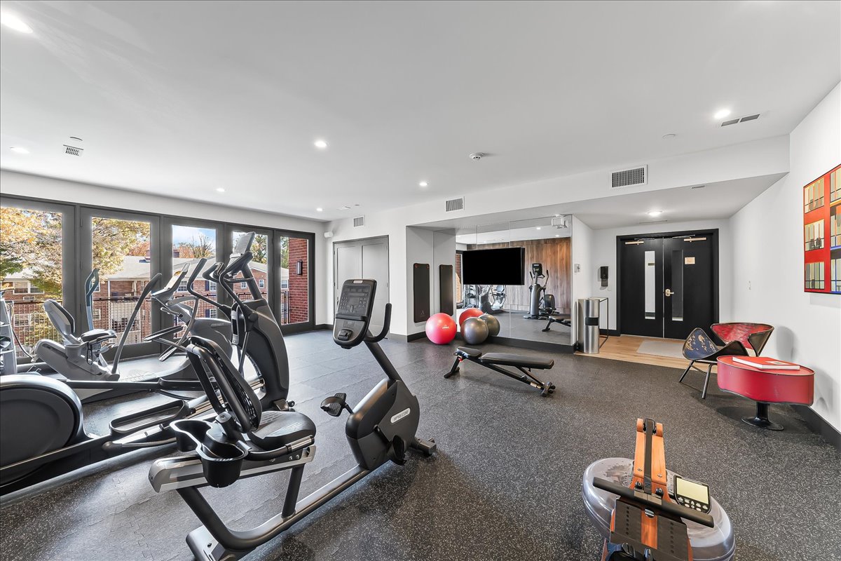 427 East Lancaster Avenue Wayne, PA 19087 - Photo 29 of 35 a room with gym equipment and a large window