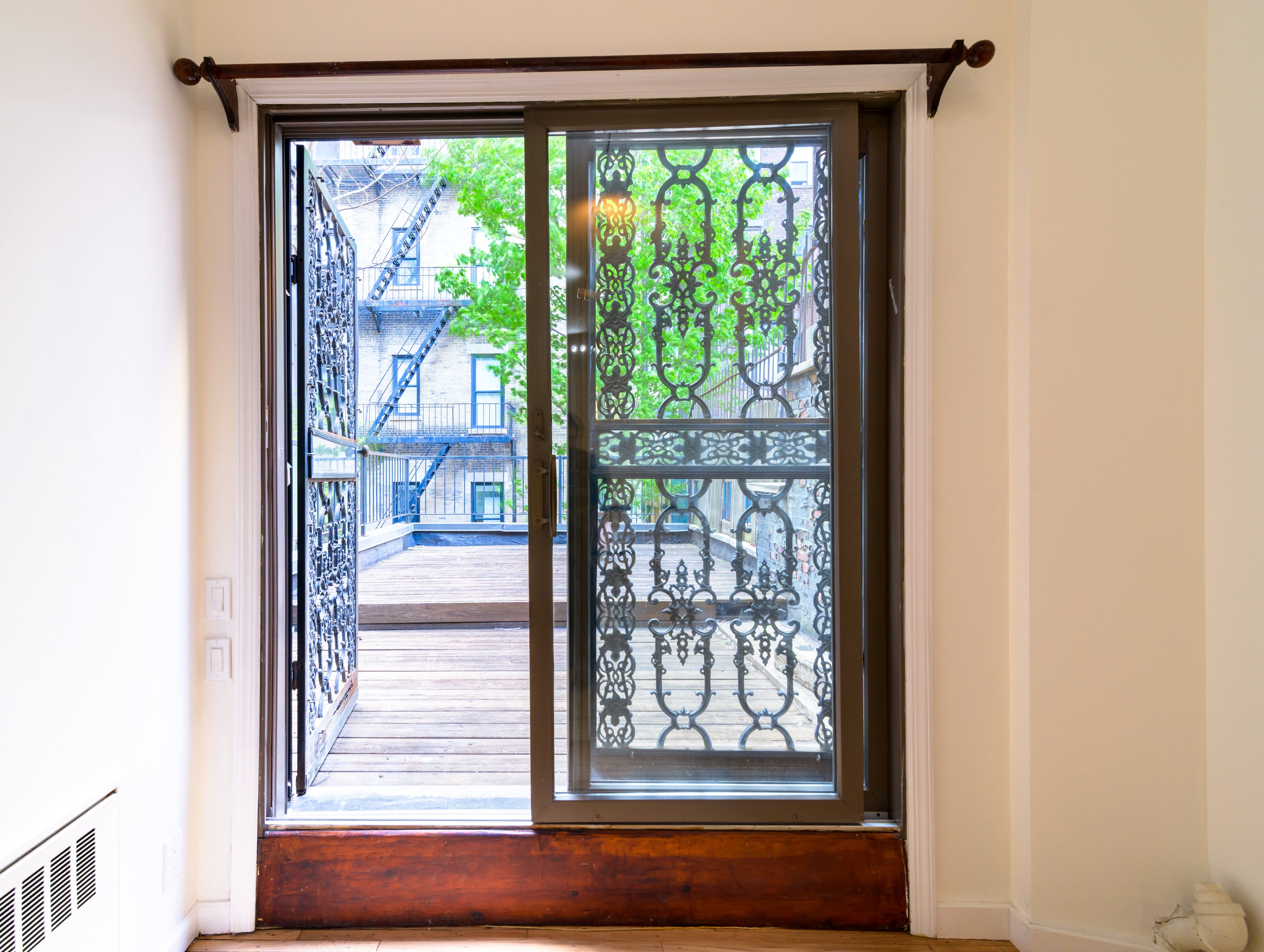 349 West 71st Street, Unit 1 Manhattan, NY 10023 - Photo 14 of 21 a view of a room that has a bed and a window