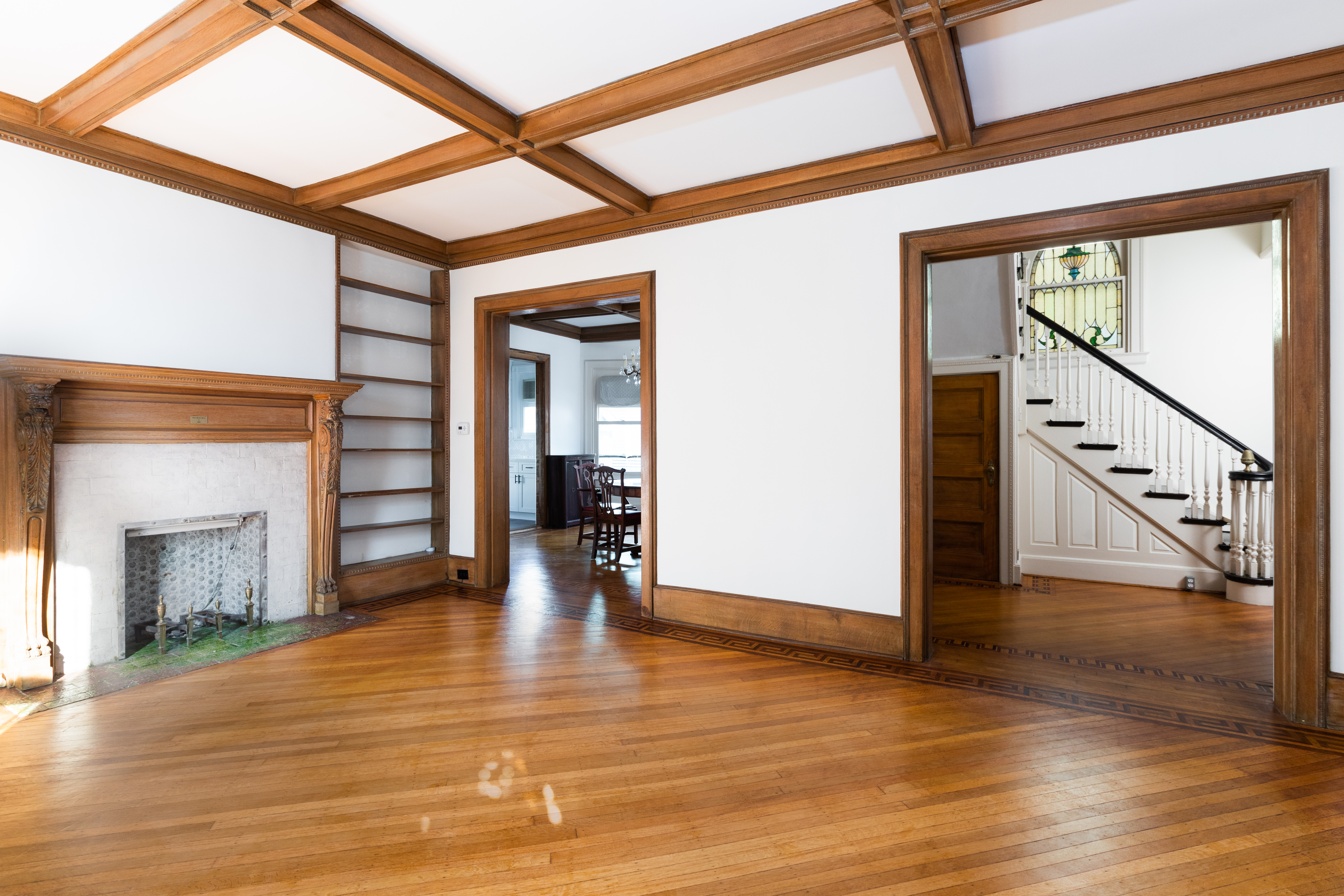 196 Marlborough Road Brooklyn, NY 11226 - Photo 7 of 23 a view of an entryway with wooden floor fireplace and windows