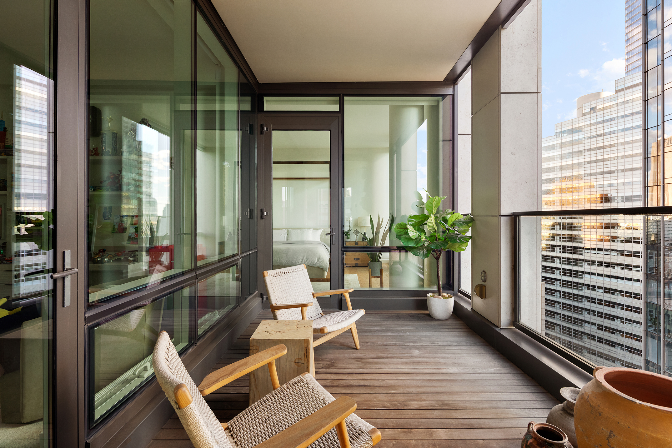 101 Warren Street, Unit 2010 Manhattan, NY 10007 - Photo 6 of 18 a living room with a couch and a table