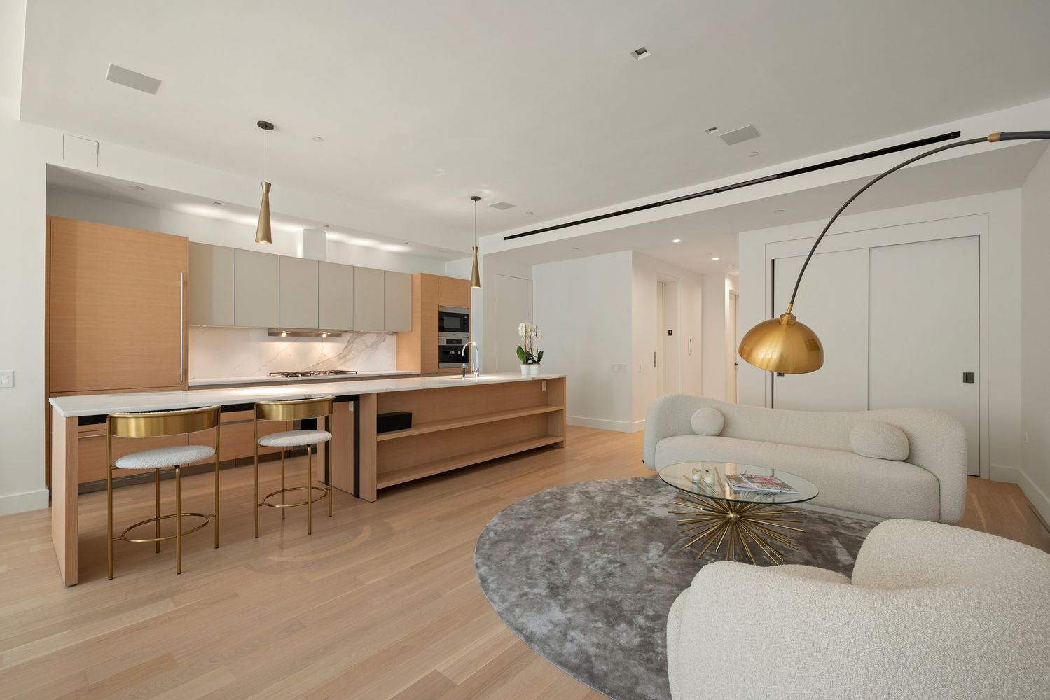 111 Mercer Street, Unit 4 Manhattan, NY 10012 - Photo 2 of 12 a living room with furniture and kitchen view