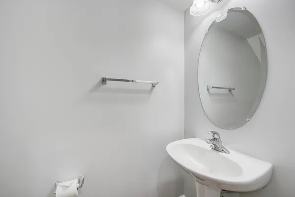 a bathroom with a sink and mirror