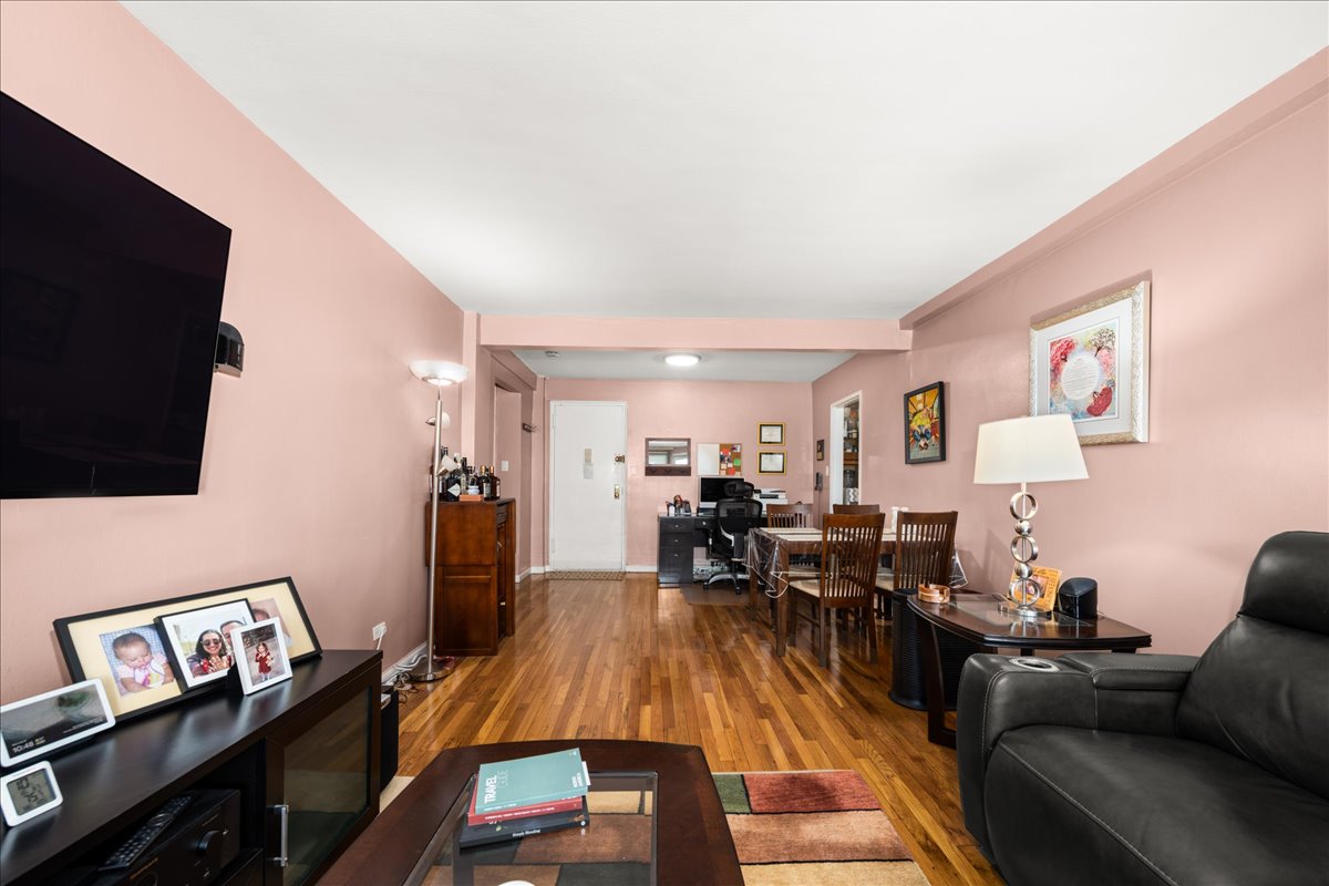 350 Ocean Parkway, Unit 3C Brooklyn, NY 11218 - Photo 4 of 10 a living room with furniture and a flat screen tv