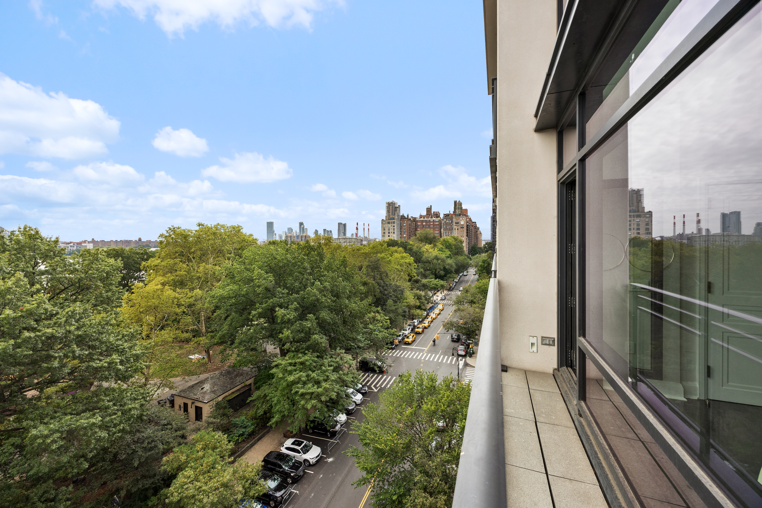 170 East End Avenue, Unit 8EF Manhattan, NY 10128 - Photo 33 of 34 a view of a balcony with wooden floor and fence