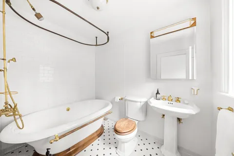 a bedroom with a bed and a fireplace