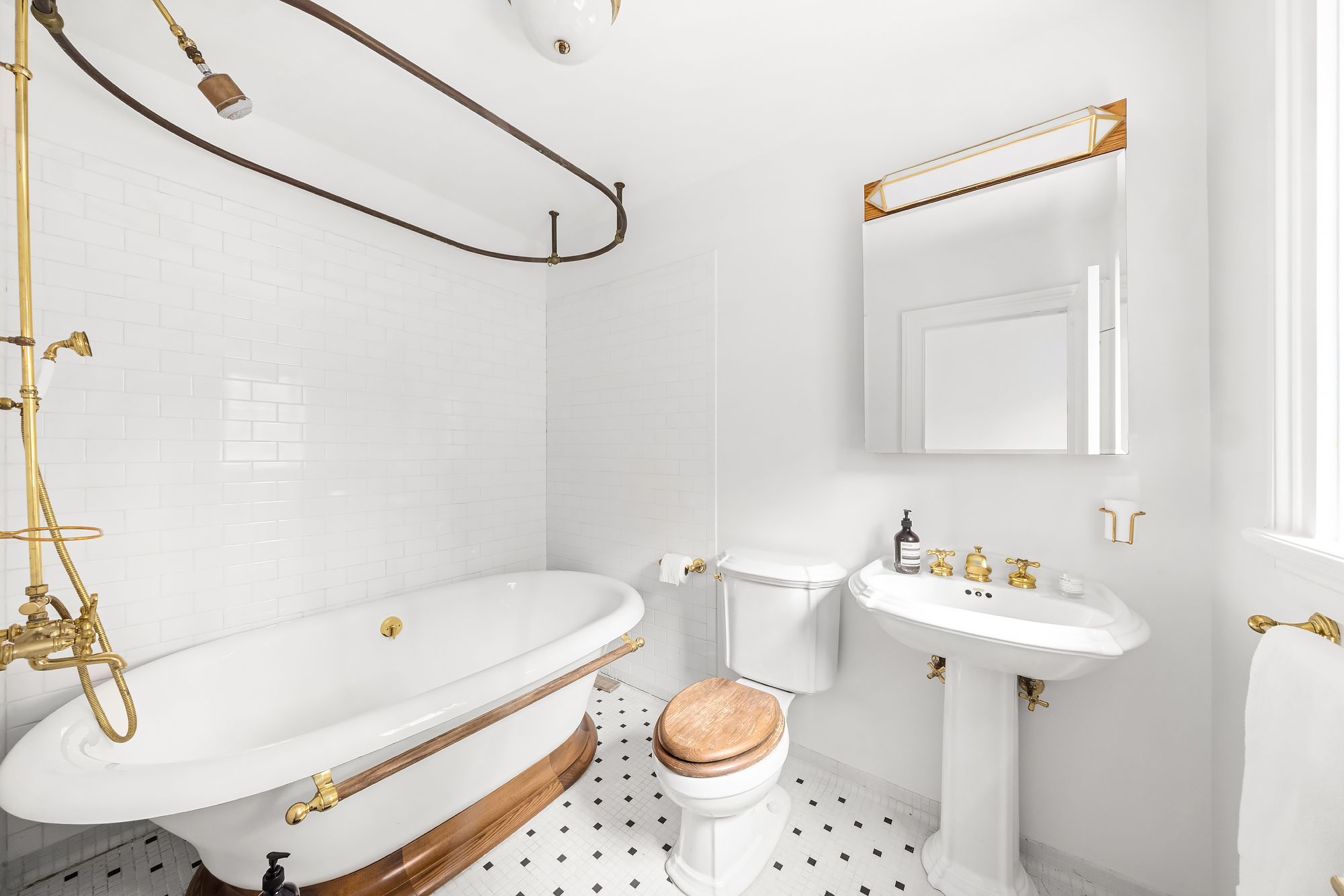 112 West 13th Street Manhattan, NY 10011 - Photo 29 of 46 a bathroom with a sink toilet and shower