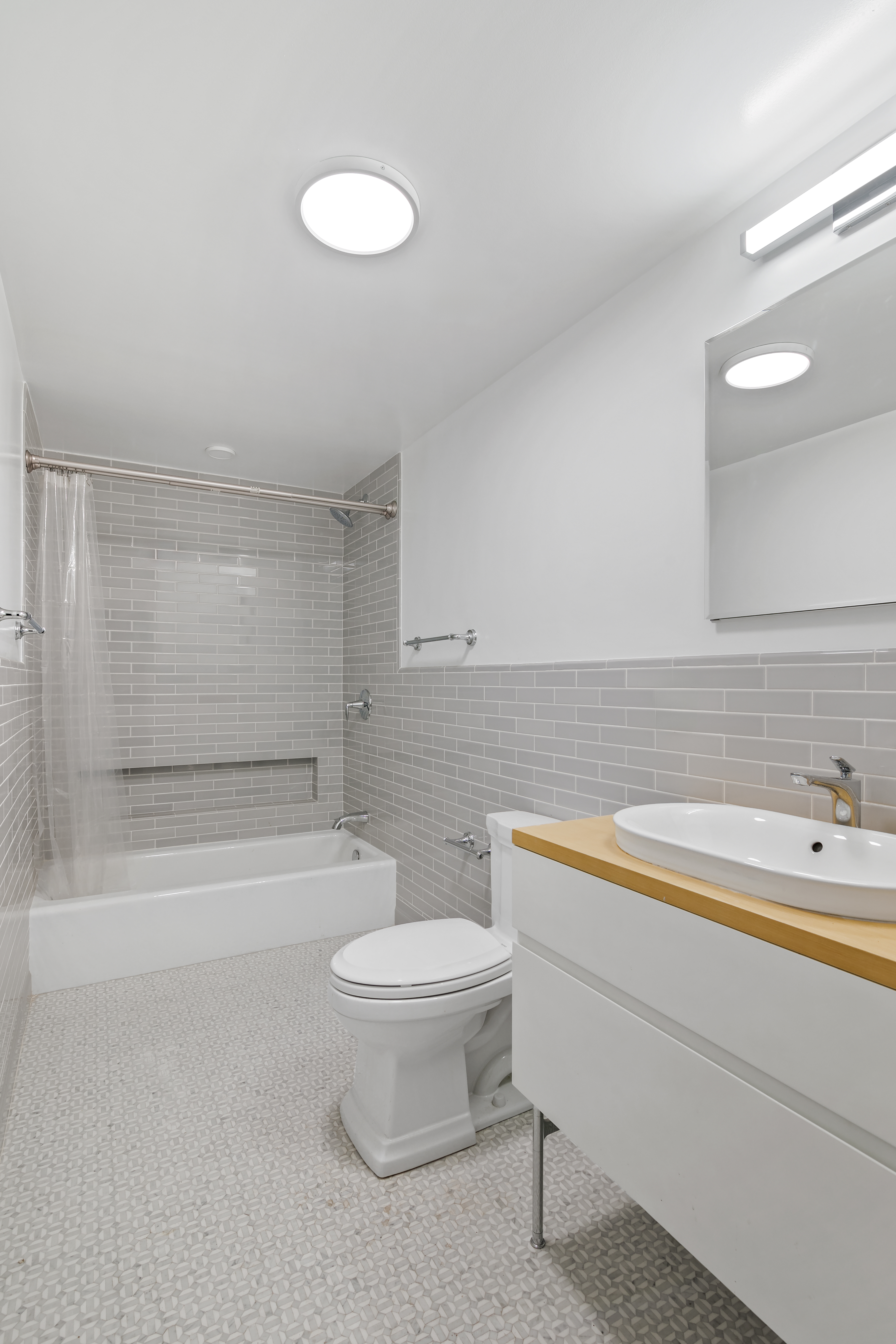 914 President Street, Unit TWNHSE Brooklyn, NY 11215 - Photo 12 of 29 a bathroom with a sink a toilet and a bathtub