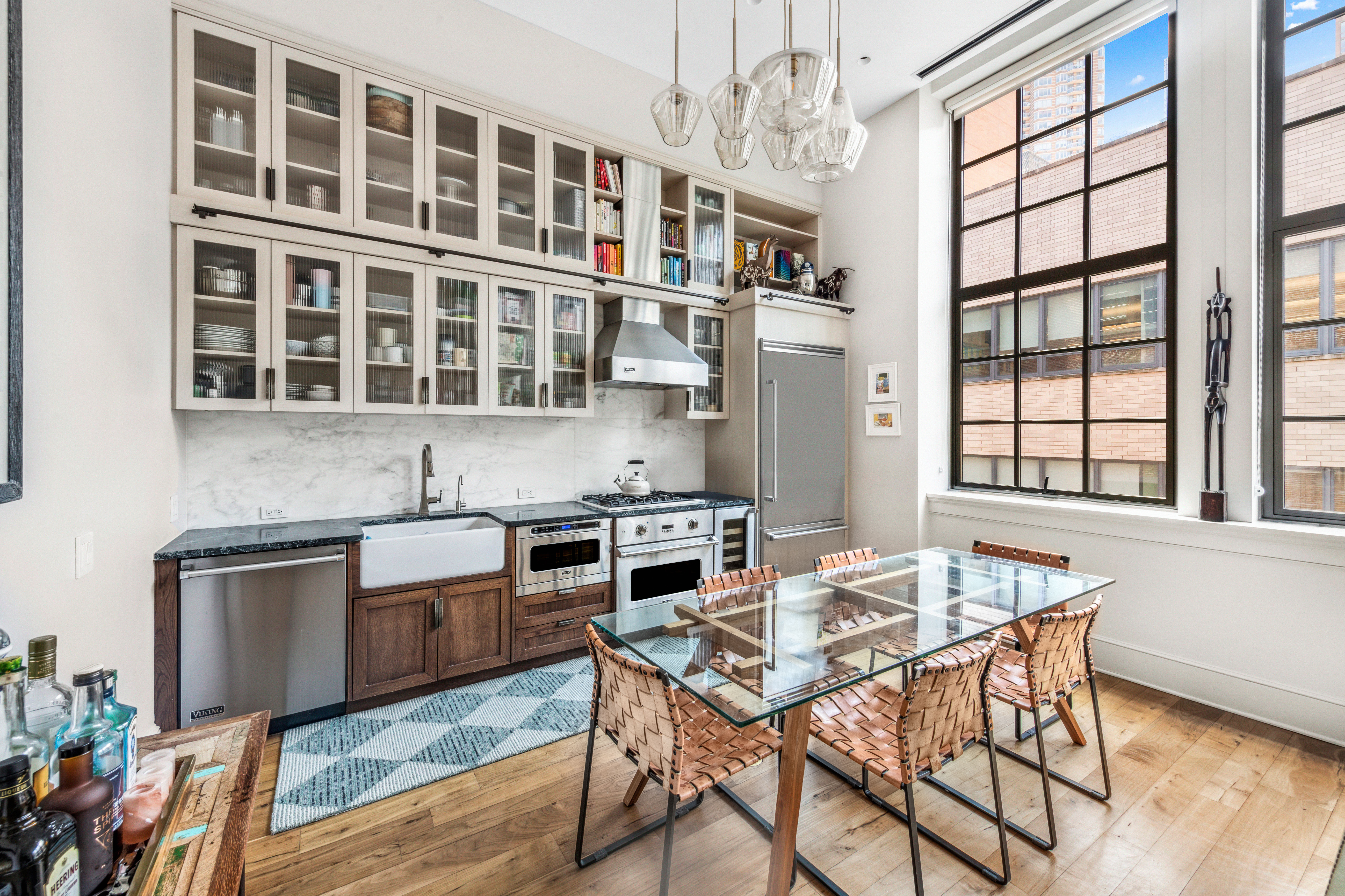 a kitchen with a table chairs stove and cabinets