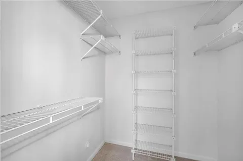 a view of an empty walk in closet
