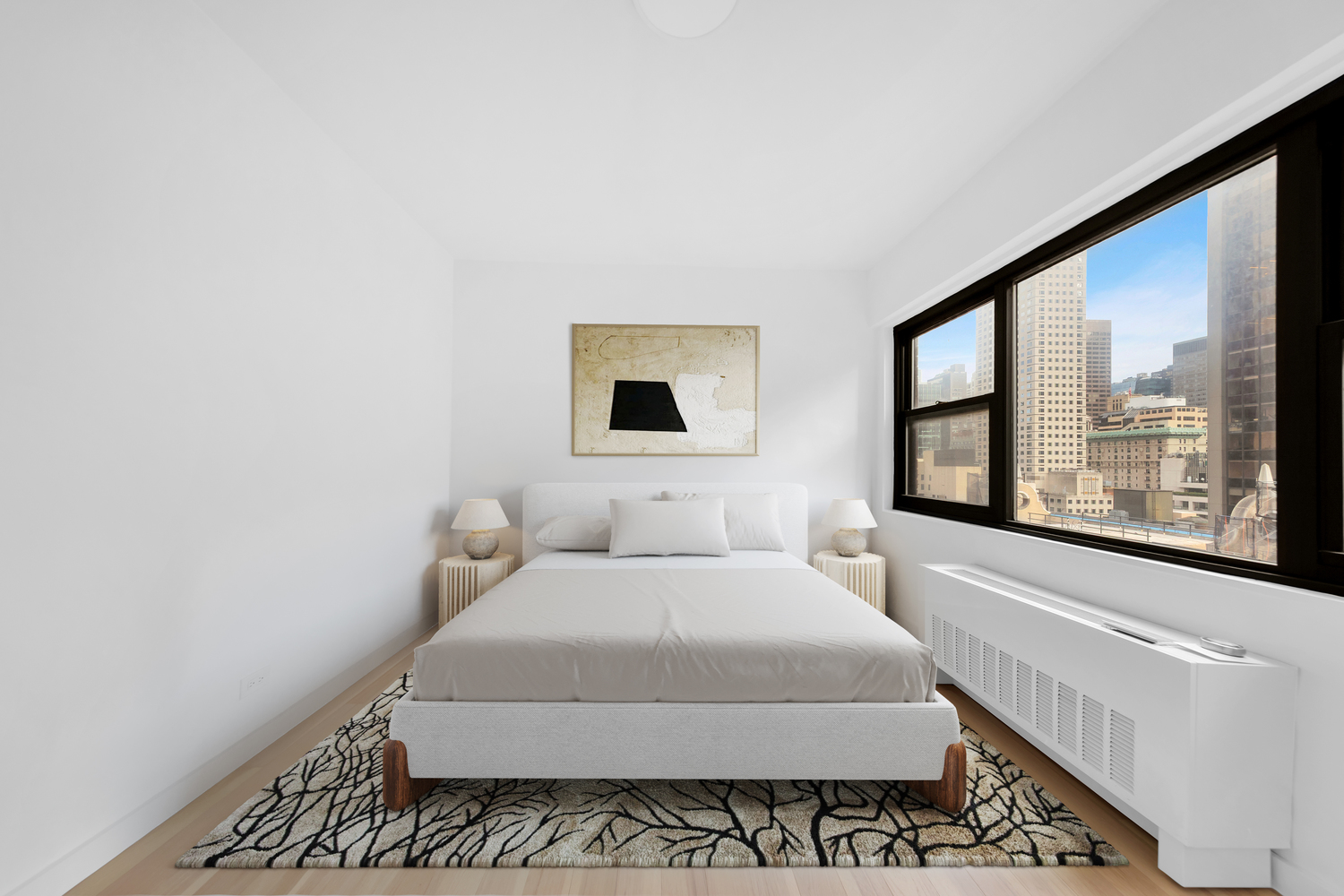 58 West 58th Street, Unit 21C Manhattan, NY 10019 - Photo 11 of 12 a bedroom with a bed and a large window