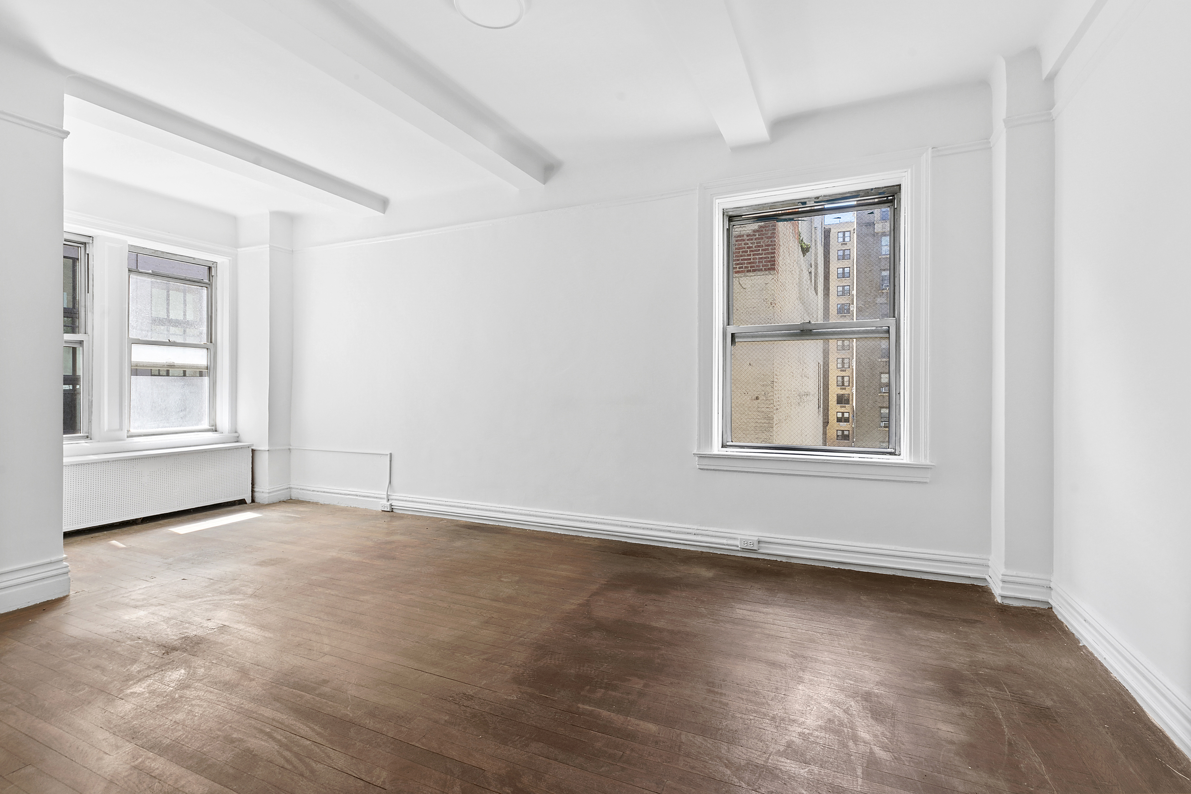 250 West 94th Street, Unit 8J Manhattan, NY 10025 - Photo 6 of 19 an empty room with windows