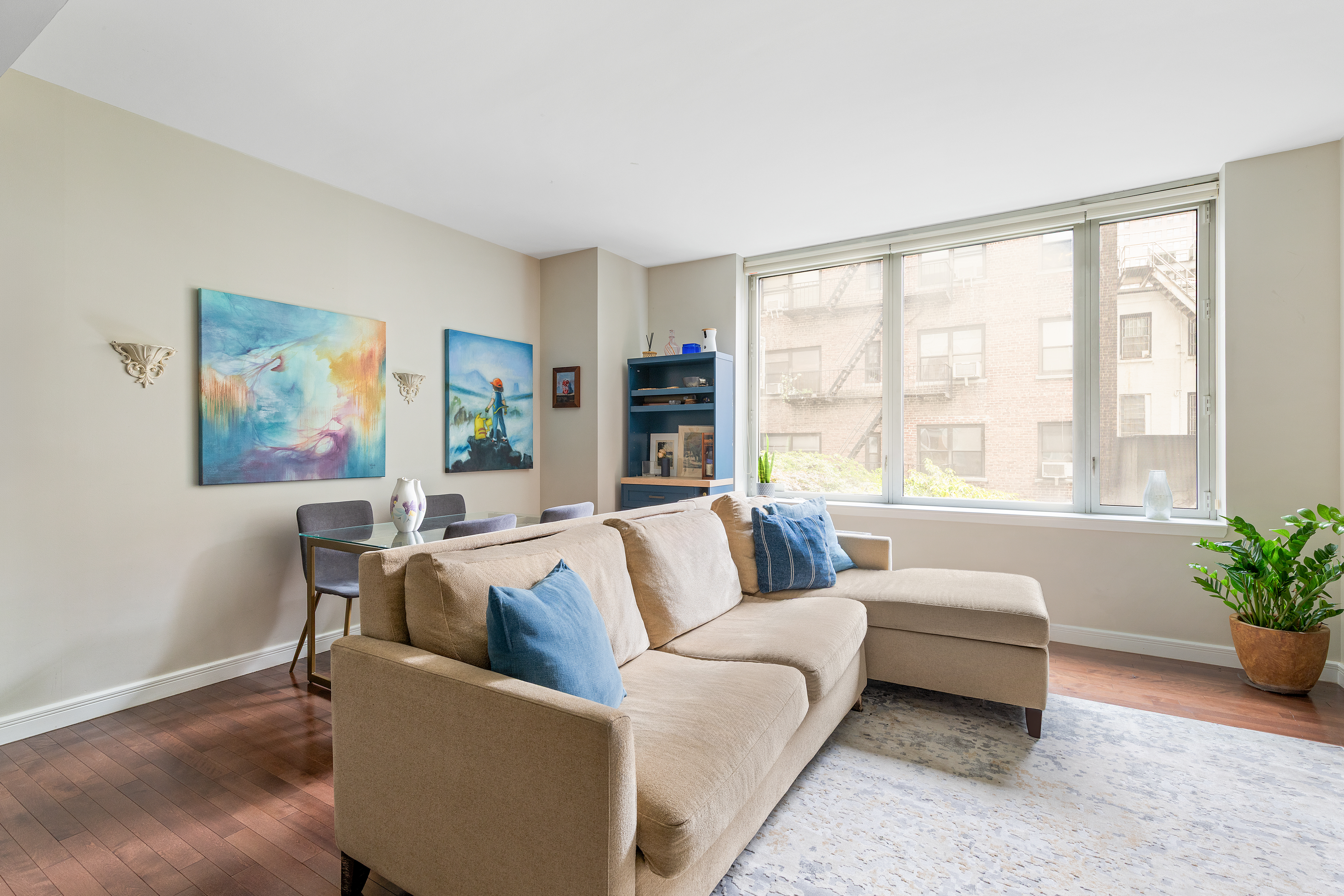 225 East 34th Street, Unit 3K Manhattan, NY 10016 - Photo 2 of 19 a living room with furniture and a large window