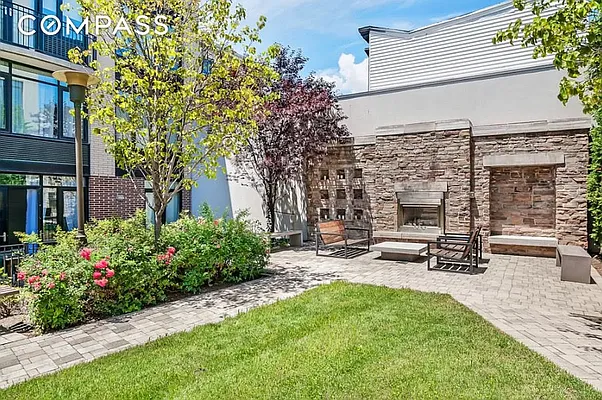 125 North 5th Street, Unit 2E Brooklyn, NY 11249 - Photo 9 of 11 a view of a patio with a table and chairs and potted plants